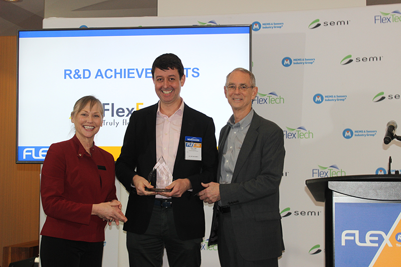 FlexEnable's Strategy Director Dr. Paul Cain collects the FLEXI Award